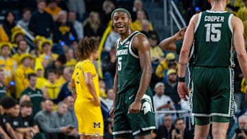 Michigan State’s Tre Holloman celebrates after the Spartans beat Michigan 75-62 in their rivalry matchup at Crisler Center in Ann Arbor on Friday, Feb. 21, 2025.