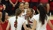Nebraska volleyball players celebrate with Manaia Ogbechie, center, after a point against Wright State. The freshman middle blocker earned her first career start and recorded eight kills and five blocks.