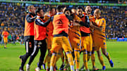 Jugadores de Tigres UANL celebran un gol.