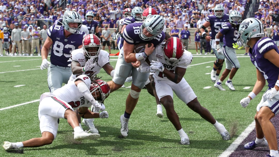 Sep 9, 2023; Manhattan, Kansas, USA; Kansas State Wildcats quarterback Will Howard (18) is stopped short of the goal line by Troy Trojans safety Caleb Ransaw (14) and cornerback Reddy Steward (2) during the fourth quarter at Bill Snyder Family Football Stadium. 