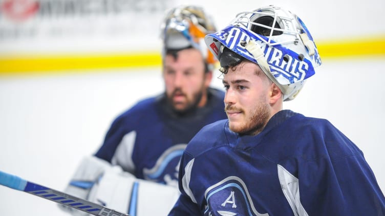 Goaltenders Yaroslav Askarov, foreground, and Troy Grosenick listen to instructions during a break in Milwaukee Admirals practice Friday, October 13, 2023, at the UW-Milwaukee Panther Arena in Milwaukee, Wisconsin.