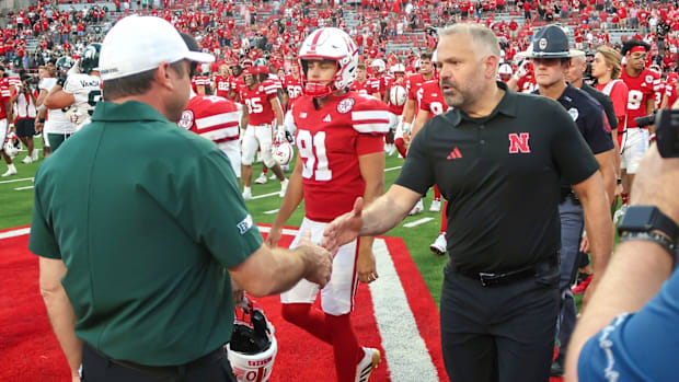 Head coaches Jonathan Smith and Matt Rhule shake hands after the 2025 Nebraska-Michigan State game in Lincoln