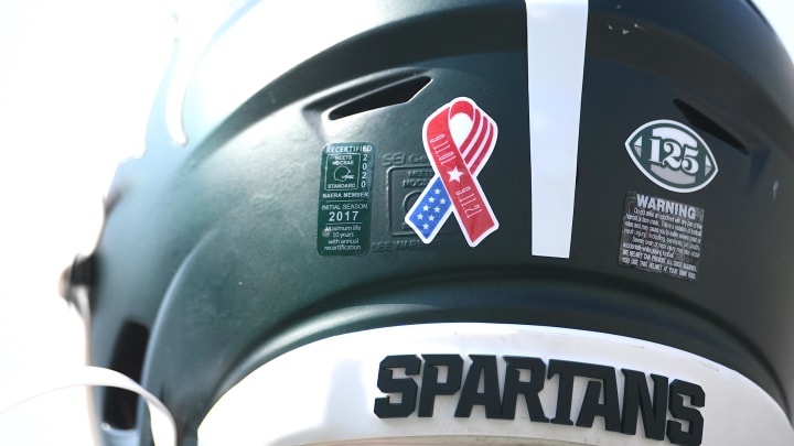 Sep 11, 2021; East Lansing, Michigan, USA; A detail view of a Michigan State Spartans helmet before the game against the Youngstown State Penguins at Spartan Stadium. Mandatory Credit: Tim Fuller-USA TODAY Sports