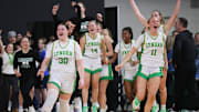 Lynden players celebrate winning the 2A girls state basketball championship game against Ellensburg on Saturday night at the Yakima Valley SunDome in Yakima, Wash. 