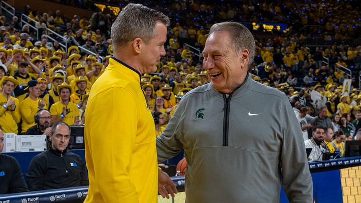 Michigan State’s Tom Izzo smiles as he greets Michigan’s Dusty May before their rivalry matchup game at Crisler Center in Ann Arbor, on Friday, Feb. 21, 2025.