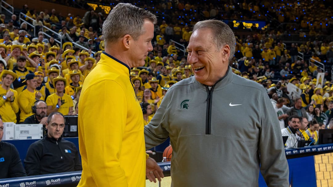 Michigan State’s Tom Izzo smiles as he greets Michigan’s Dusty May before their rivalry matchup game at Crisler Center in Ann Arbor, on Friday, Feb. 21, 2025.