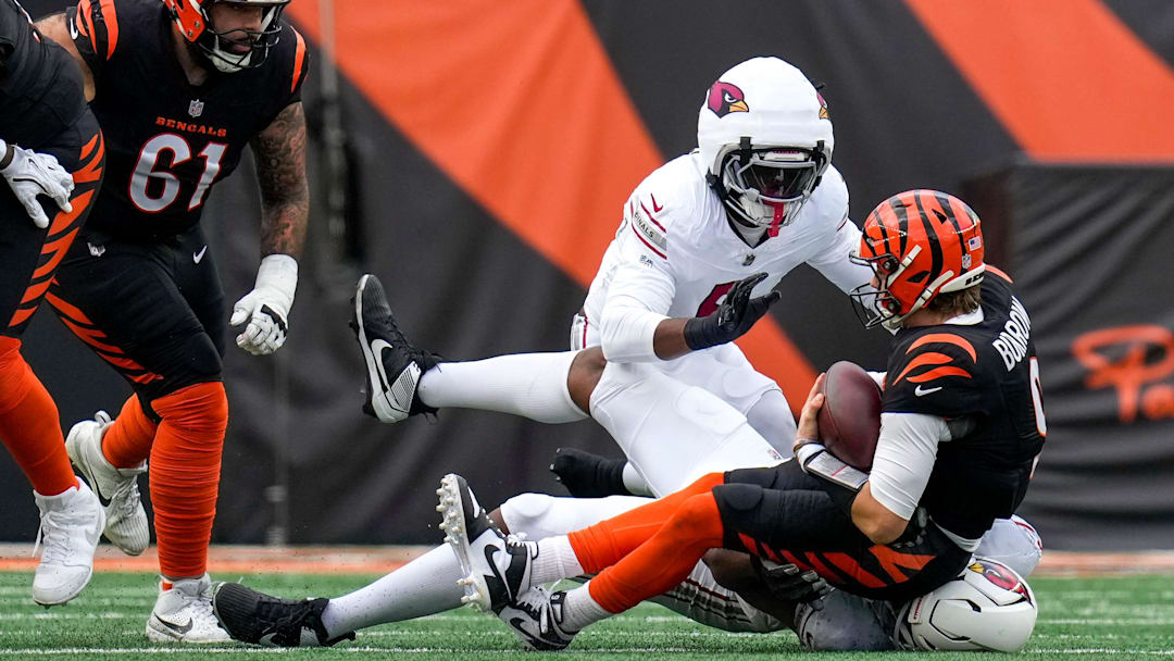 Cincinnati Bengals quarterback Joe Burrow (9) is sacked in the second quarter of the NFL Week 17 game between the Cincinnati Bengals and the Arizona Cardinals at Paycor Stadium in Downtown Cincinnati on Sunday, Dec. 28, 2025. The Bengals led 23-7 at halftime.