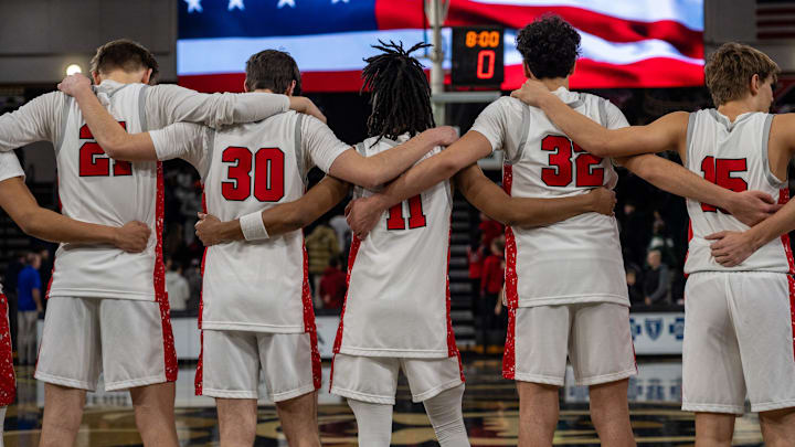 The Orchard Lake St. Mary’s basketball team members embrace one another during the pledge of allegiance before their game against IMG Academy at Oakland University in Rochester on Thursday, Jan. 9, 2025. The Orchard Lake St. Mary’s basketball team members embrace one another during the pledge of allegiance before their game against IMG Academy at Oakland University in Rochester on Thursday, Jan. 9, 2025.