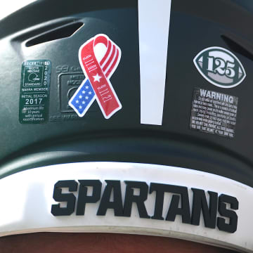 Sep 11, 2021; East Lansing, Michigan, USA; A detail view of a Michigan State Spartans helmet before the game against the Youngstown State Penguins at Spartan Stadium. Mandatory Credit: Tim Fuller-USA TODAY Sports
