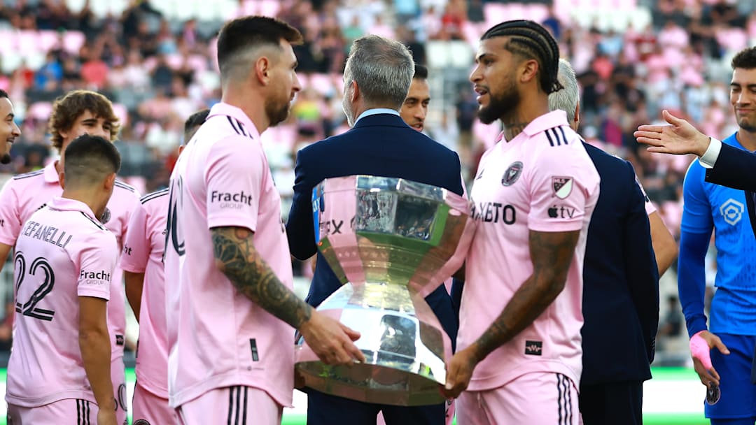 Inter Miami CF captain Lionel Messi and former captain DeAndre Yedlin prepare to lift the inaugural Leagues Cup trophy after beating Nashville SC on Aug. 19, 2023, at Geodis Park.