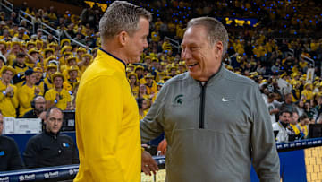 Michigan State’s Tom Izzo smiles as he greets Michigan’s Dusty May before their rivalry matchup game at Crisler Center in Ann Arbor, on Friday, Feb. 21, 2025.