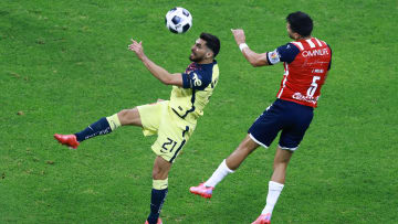 Henry Martin and Jesús Molina dispute a ball.