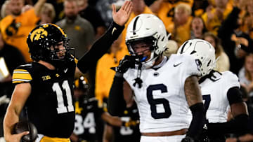 Iowa Hawkeyes quarterback Mark Gronowski (11) signals first down during a college football game against the Penn State Nittany Lions Oct. 18, 2025 at Kinnick Stadium in Iowa City, Iowa.
