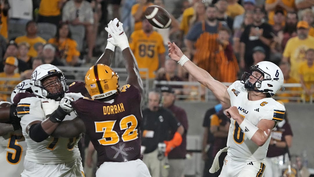 Arizona State Sun Devils defensive lineman Prince Dorbah (32) attempts to block the pass by Northern Arizona Lumberjacks quarterback Ty Pennington (6) during a football game at Mountain America Stadium in Tempe on Aug. 30, 2025.