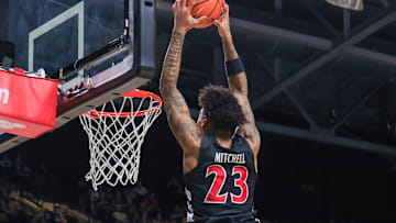 Feb 5, 2025; Orlando, Florida, USA; Cincinnati Bearcats forward Dillon Mitchell (23) dunks during the first half against the UCF Knights at Addition Financial Arena. Mandatory Credit: Mike Watters-Imagn Images