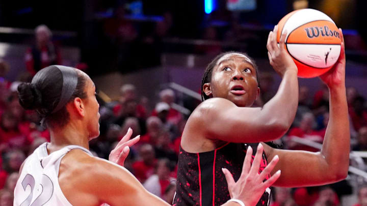 Las Vegas Aces center A'ja Wilson (22) defends Indiana Fever forward Aliyah Boston (7) as she shoots during Game 4 of the WNBA semifinals on Sunday, Sept. 28, 2025, at Gainbridge Fieldhouse in Indianapolis. The Fever defeated the Aces 90-83.