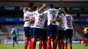 Jugadores de Rayados de Monterrey celebran un gol.