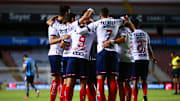 Jugadores de Rayados de Monterrey celebran un gol.