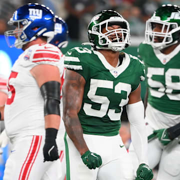 Aug 24, 2024; East Rutherford, New Jersey, USA; New York Jets linebacker Zaire Barnes (53) reacts to a defensive play against the New York Giants during the first half at MetLife Stadium. 