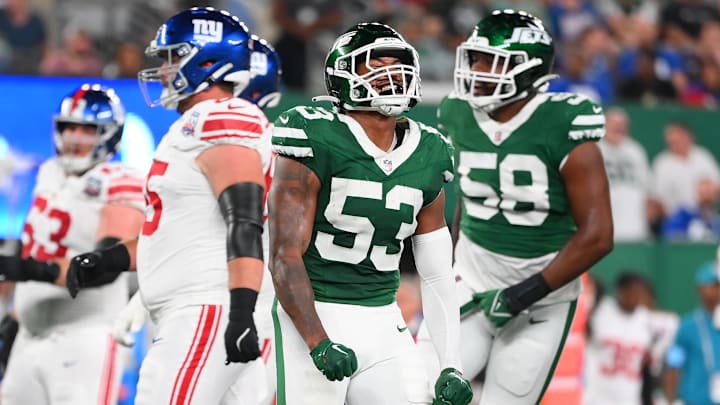 Aug 24, 2024; East Rutherford, New Jersey, USA; New York Jets linebacker Zaire Barnes (53) reacts to a defensive play against the New York Giants during the first half at MetLife Stadium. 