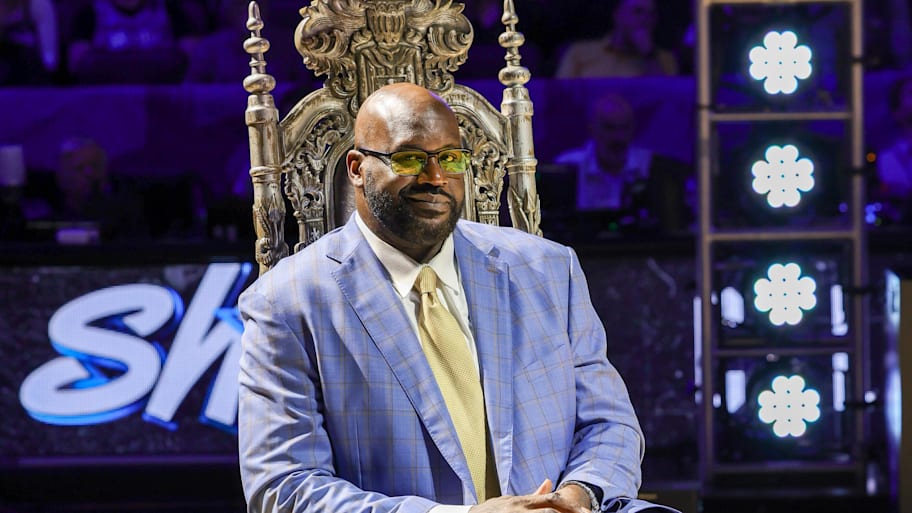 Shaq smiles during a ceremony to retire his #32 jersey at Orlando's Amway Center. | Mike Watters-Imagn Images