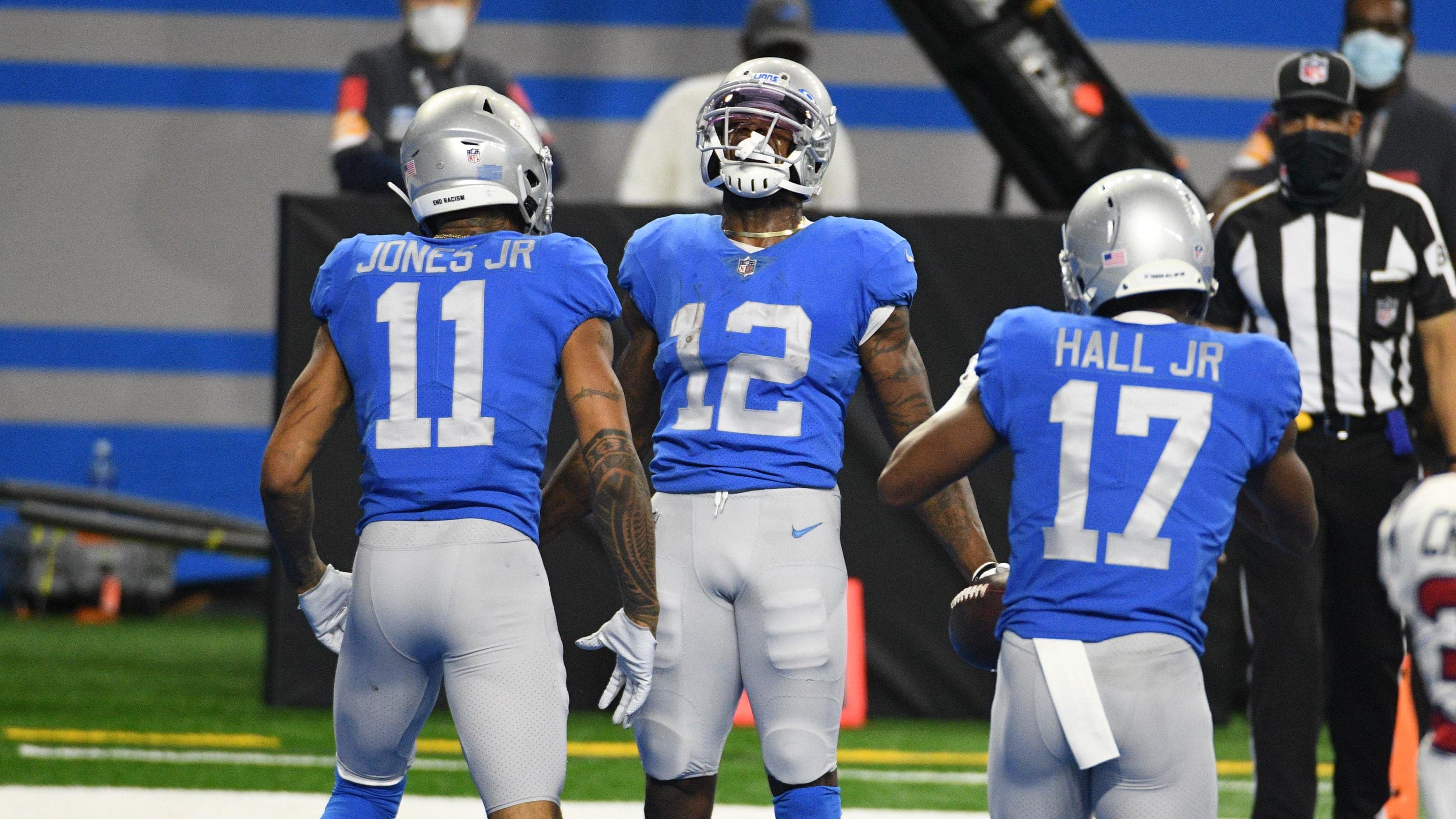 Detroit Lions wide receiver Mohamed Sanu (12) celebrates his touchdown.