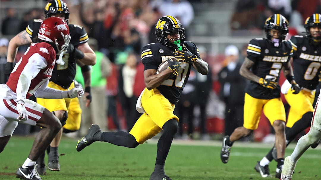 Nov 29, 2025; Fayetteville, Arkansas, USA; Missouri Tigers running back Jamal Roberts (20) rushes during the fourth quarter against the Arkansas Razorbacks at Donald W. Reynolds Razorback Stadium. Missouri won 31-17. Mandatory Credit: Nelson Chenault-Imagn Images Nov 29, 2025; Fayetteville, Arkansas, USA; Missouri Tigers running back Jamal Roberts (20) rushes during the fourth quarter against the Arkansas Razorbacks at Donald W. Reynolds Razorback Stadium. Missouri won 31-17. Mandatory Credit: Nelson Chenault-Imagn Images