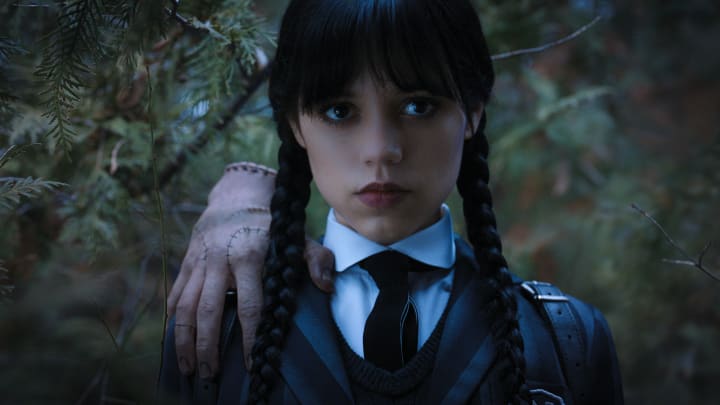 Wednesday. (L to R) Thing, Jenna Ortega as Wednesday Addams in episode 104 of Wednesday. Cr. Courtesy of Netflix © 2022