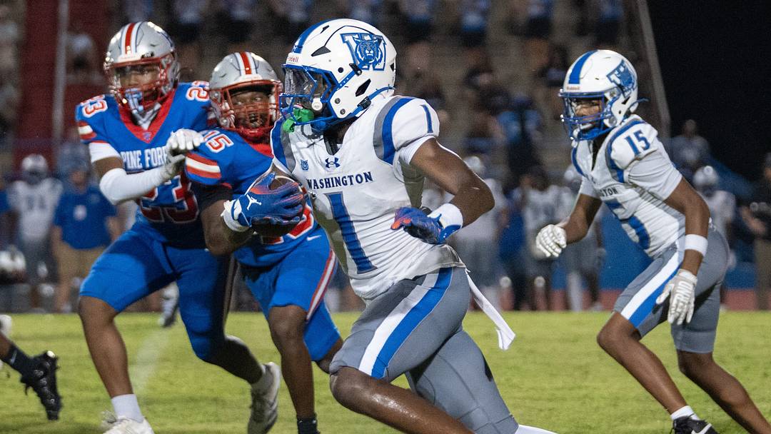 Wildcats Gionni Lewis (1) carries the ball against the Eagles during the Booker T. Washington vs Pine Forest football game at Pine Forest High School in Pensacola on Aug. 21, 2026. Wildcats Gionni Lewis (1) carries the ball against the Eagles during the Booker T. Washington vs Pine Forest football game at Pine Forest High School in Pensacola on Aug. 21, 2026.
