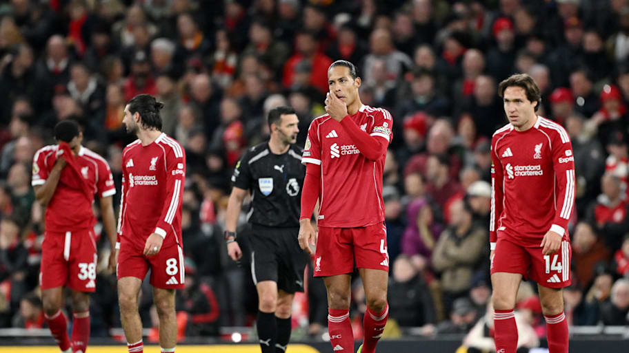 Virgil van Dijk and Federico Chiesa look on with dismay.