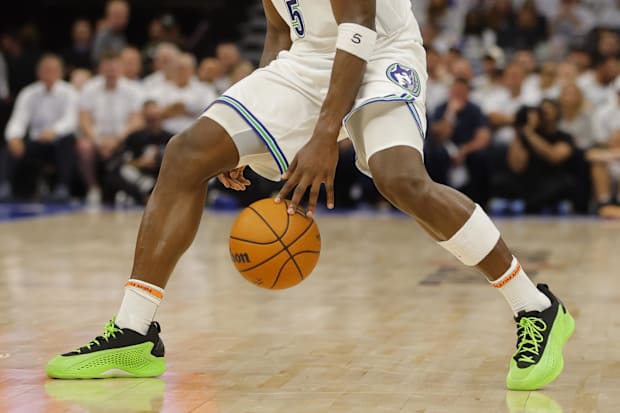 Minnesota Timberwolves guard Anthony Edwards controls the ball against the Dallas Mavericks.