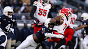 Nov 30, 2024; University Park, Pennsylvania, USA; ) Penn State Nittany Lions defensive end Abdul Carter (11) sacks Maryland Terrapins quarterback MJ Morris (7) during the first quarter at Beaver Stadium.  