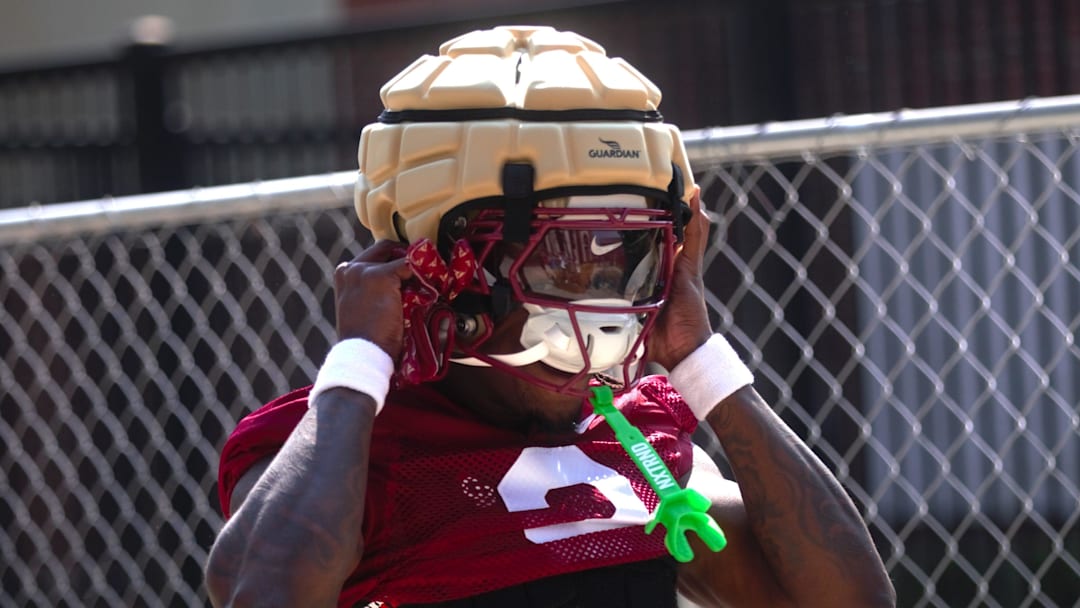 FSU football players walk into the first spring practice of the spring season on Wednesday, March 19, 2025