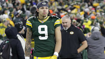 Dec 23, 2024; Green Bay, Wisconsin, USA;  Green Bay Packers wide receiver Christian Watson (9) leaves the field in the fourth quarter after getting injured against the New Orleans Saints at Lambeau Field. Mandatory Credit: Dan Powers-USA TODAY NETWORK/Imagn Images