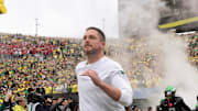 Oregon coach Dan Lanning leads his team onto the field before the game against Indiana at Autzen Stadium October 11, 2025.