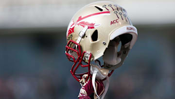 Nov 9, 2013; Winston-Salem, NC, USA; A Florida State Seminoles player holds up a helmet prior to kickoff against the Wake Forest Demon Deacons at BB&T Field. Mandatory Credit: Jeremy Brevard-Imagn Images