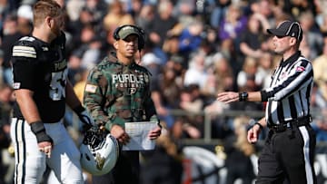 Purdue Boilermakers offensive lineman Gus Hartwig (53) and Purdue Boilermakers head coach Ryan Walters talk to an official ahead of the overtime coin toss Saturday, Nov. 2, 2024, during the NCAA football game against the Northwestern Wildcats at Ross-Ade Stadium in West Lafayette, Ind. Northwestern Wildcats won 26-20.