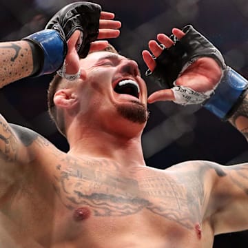 Nov 11, 2023; New York, NY, USA; Tom Aspinall (blue gloves) reacts to beating Sergei Pavlovich (red gloves) during UFC 295 at Madison Square Garden. Mandatory Credit: Wendell Cruz-Imagn Images