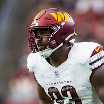 Washington Commanders defensive tackle Jonathan Allen gets ready for a play.