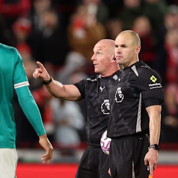 Simon Hooper (second right) was injured during the first half.