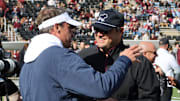 Mississippi Rebels head coach Lane Kiffin greets Mississippi State Bulldogs head coach Jeff Lebby before the game at Davis Wade Stadium at Scott Field.