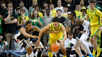 Oregon guard Jackson Shelstad dives after a loose ball as the Oregon Ducks host the Arizona Wildcats Saturday, Jan. 27, 2024 at Matthew Knight Arena in Eugene, Ore.