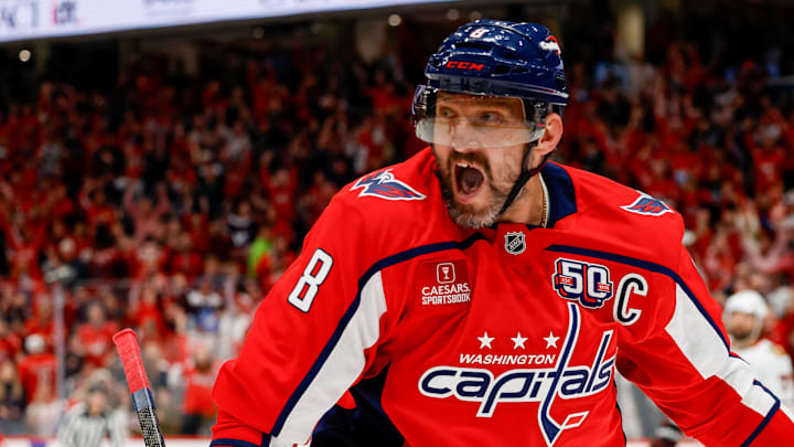 Ovechkin celebrates scoring a goal against the Chicago Blackhawks, a game during which he tied Gretzky's all-time goals record. Ovechkin celebrates scoring a goal against the Chicago Blackhawks, a game during which he tied Gretzky's all-time goals record.