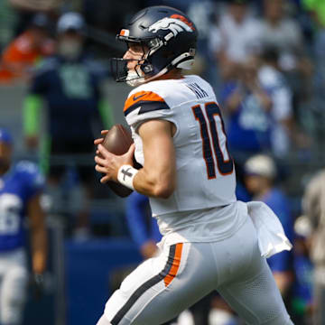 Sep 8, 2024; Seattle, Washington, USA; Denver Broncos quarterback Bo Nix (10) looks to pass against the Seattle Seahawks during the second quarter at Lumen Field. Mandatory Credit: Joe Nicholson-Imagn Images