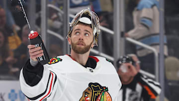 Apr 8, 2025; Pittsburgh, Pennsylvania, USA;  Chicago Blackhawks goaltender Spencer Knight (30) squirts water during a time-out against the Pittsburgh Penguins in the third period at PPG Paints Arena. Mandatory Credit: Charles LeClaire-Imagn Images