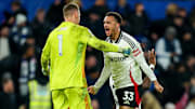 Bernd Leno (left) and Anthony Robinson (right) celebrate Fulham's first win at Stamford Bridge in 45 years.