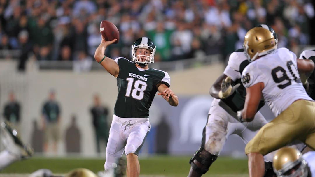 Sep. 18, 2010; East Lansing, MI, USA; Michigan State Spartans holder Aaron Bates (18) throws the ball on a fake field goal in overtime for the game winning score against the Notre Dame Fighting Irish. Michigan State won 34-31 in overtime. Mandatory Credit: Matt Cashore-Imagn Images