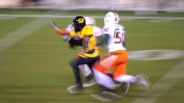 Dec. 27, 2008; San Francisco, CA, USA; California Golden Bears running back Jahvid Best (left) runs the ball during the fourth quarter in the 2008 Emerald Bowl against the Miami Hurricanes at AT&T Park in San Francisco, CA. The Golden Bears defeated the Hurricanes 24-17. Mandatory Credit: Kyle Terada-Imagn Images