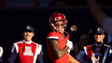 Nov 30, 2024; Tucson, Arizona, USA; Arizona Wildcats wide receiver Tetairoa McMillan (4) celebrates a touchdown against the Arizona State Sun Devils in the second half during the Territorial Cup at Arizona Stadium. Mandatory Credit: Mark J. Rebilas-Imagn Images