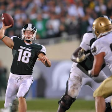 Sep. 18, 2010; East Lansing, MI, USA; Michigan State Spartans holder Aaron Bates (18) throws the ball on a fake field goal in overtime for the game winning score against the Notre Dame Fighting Irish. Michigan State won 34-31 in overtime. Mandatory Credit: Matt Cashore-Imagn Images